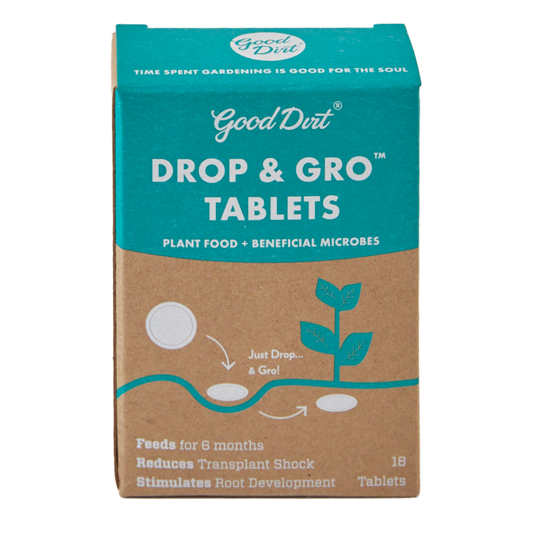 Box of Good Dirt Drop and Gro tablets. Top of Box reads Good Dirt, time spent gardening is good for the soul. Face of box reads 18 tablets. Plant food and beneficial microbes. Just drop and grow. Feeds for six months. Reduces transplant shock. Stimulates root development.